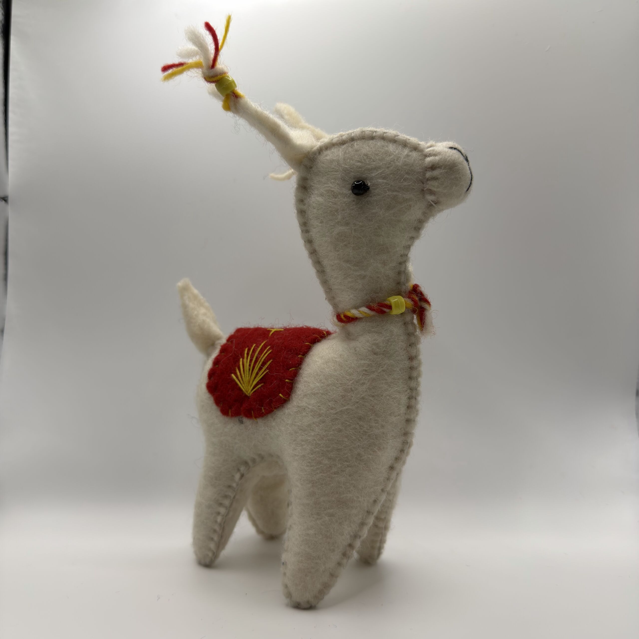 gray-llama-festive-red-saddle-felt-ornament